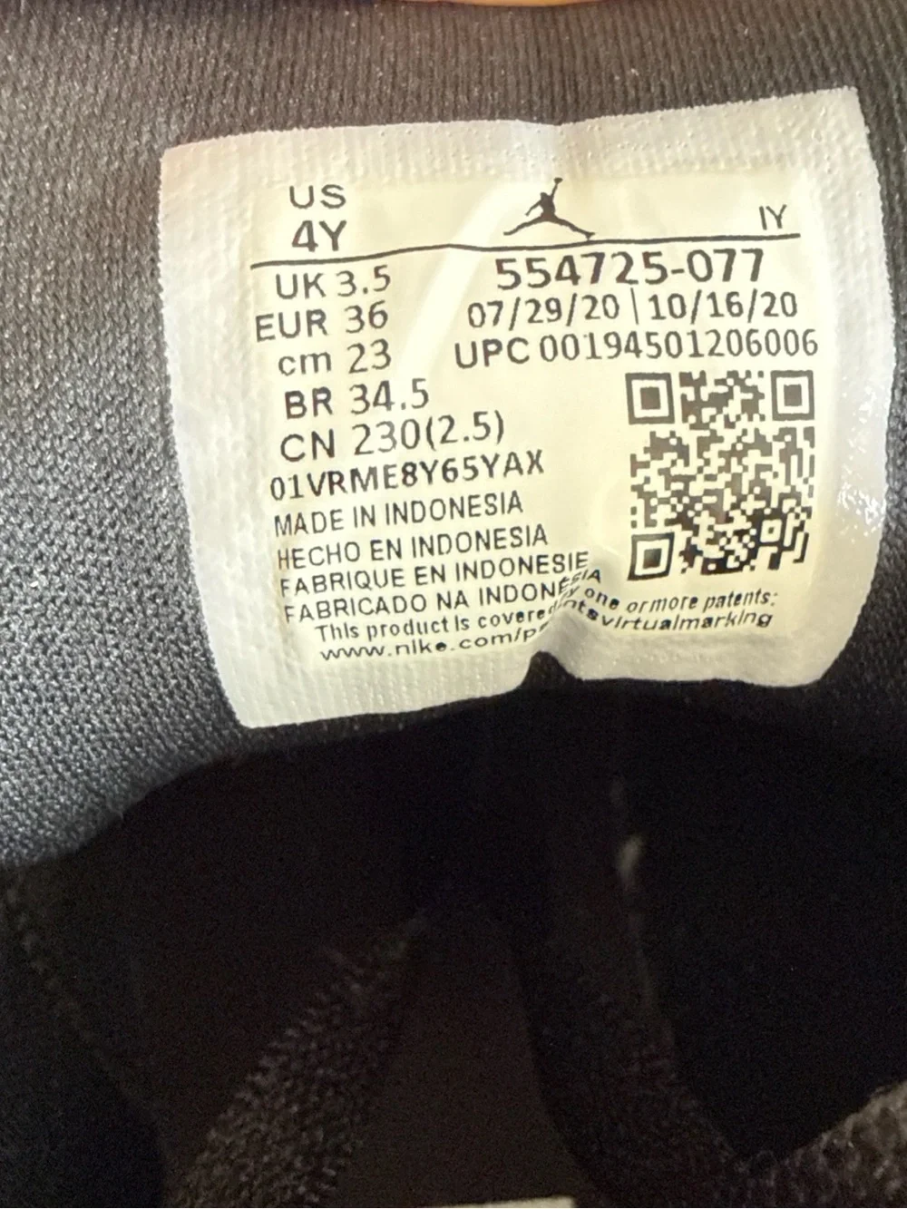 Nike Black and White Youth Sneakers with Size Tag